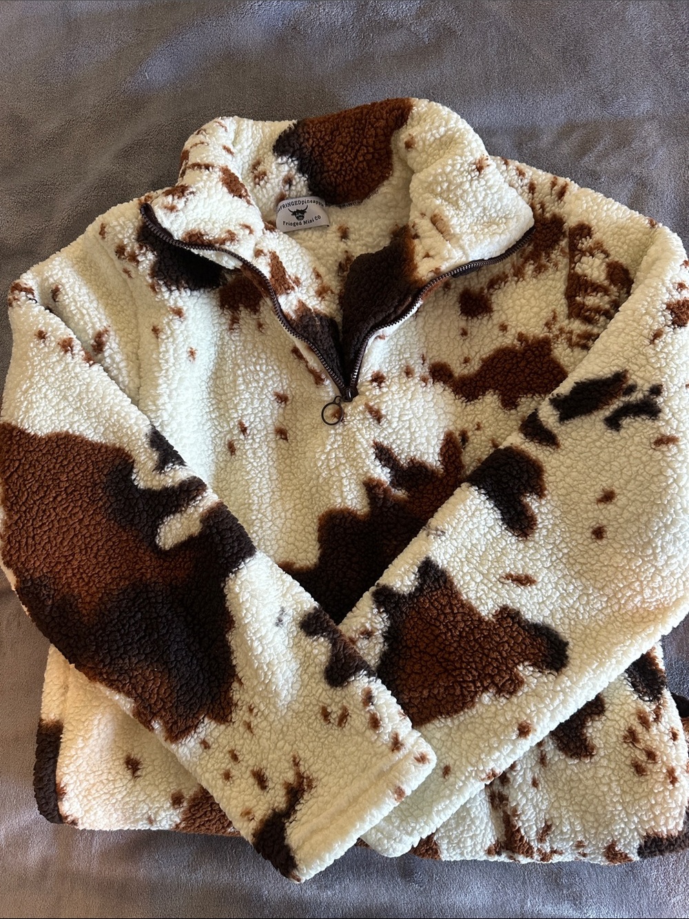 The Fringed Pineapple Cow Print Sherpa Quarter Zip size M